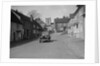 Standard Sixteen saloon driving down the High Street, Hambledon, Hampshire, 1930s by Bill Brunell