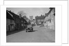 Standard Sixteen saloon driving down the High Street, Hambledon, Hampshire, 1930s by Bill Brunell