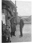 Group of people outside a Metropolitan Line railway station, London, 1930s. by Bill Brunell