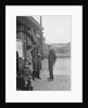 Group of people outside a Metropolitan Line railway station, London, 1930s. by Bill Brunell