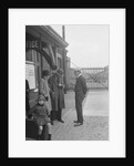 Group of people outside a Metropolitan Line railway station, London, 1930s. by Bill Brunell