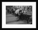 Kitty Brunell in her Aston Martin, chatting to a man in Highland dress, RSAC Scottish Rally, 1933 by Bill Brunell