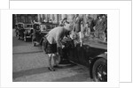 Kitty Brunell in her Aston Martin, chatting to a man in Highland dress, RSAC Scottish Rally, 1933 by Bill Brunell