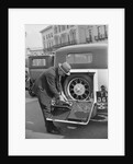 A driver opening the fitted toolkit of his Ford Model A at the Southport Rally, 1928 by Bill Brunell