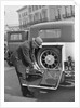 A driver opening the fitted toolkit of his Ford Model A at the Southport Rally, 1928 by Bill Brunell