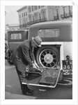 A driver opening the fitted toolkit of his Ford Model A at the Southport Rally, 1928 by Bill Brunell