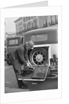 A driver opening the fitted toolkit of his Ford Model A at the Southport Rally, 1928 by Bill Brunell