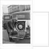 A driver opening the fitted toolkit of his Ford Model A at the Southport Rally, 1928 by Bill Brunell