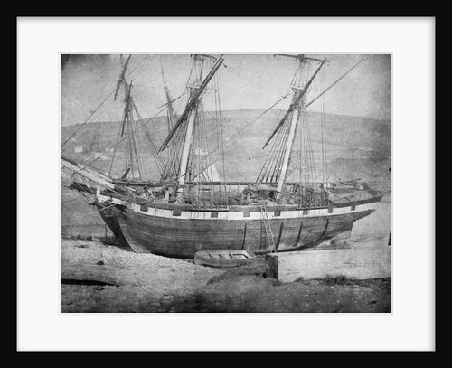 Broadside view of two unidentified vessels at low tide by unknown