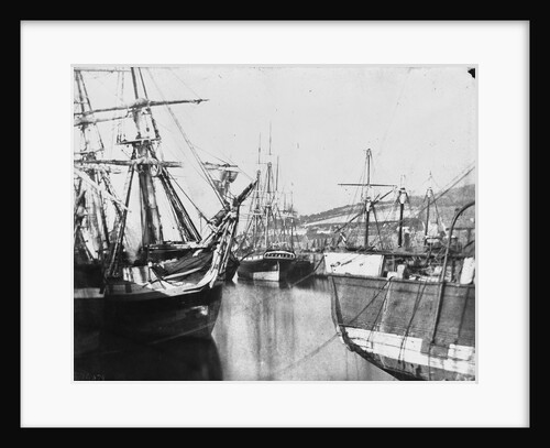 Bow view of an unidentified ship, stern of another, at low tide, Swansea by unknown