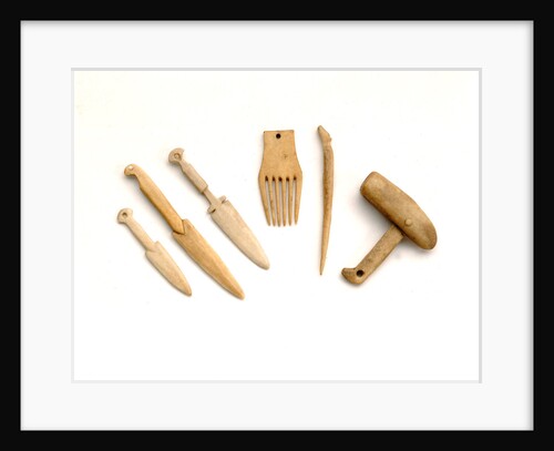 Ivory model of a snow knife, awl, comb by unknown