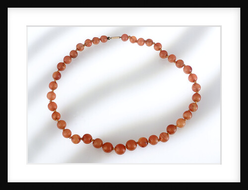 Amber beads by unknown
