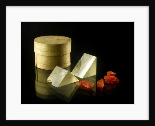 Pill box containing two prisms and red coloured crystals by unknown