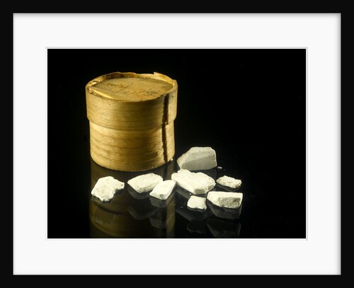 Pill box containing eight chalky white plaster-like crystals by unknown