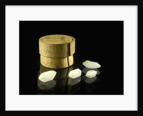 Pill box containing four cloudy white crystals by Unknown