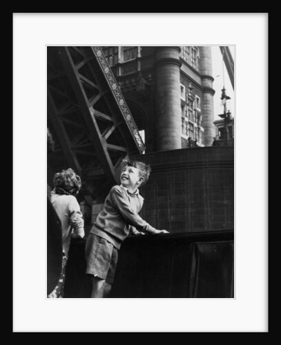Delighted children on board the pleasure steamer 'Golden Eagle'as it passes beneath Tower Bridge by unknown