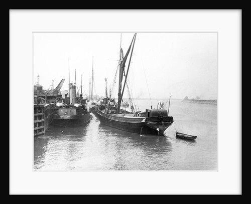 The 'Olive May' (1920), a port quarter view of the barge motoring to quayside with her tender in tow (sails furled) by Anonymous