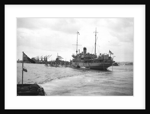 HMS 'Titania' (1915) submarine depot ship, moored at Portland with 6 submarines alongside by unknown