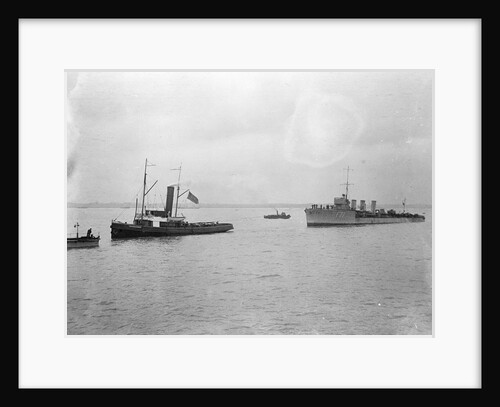 Rescue tug HMS 'Vanquisher' (1899) entering the floating dock at Harwich with the mined destroyer 'Thisbe' (1917) in tow by unknown
