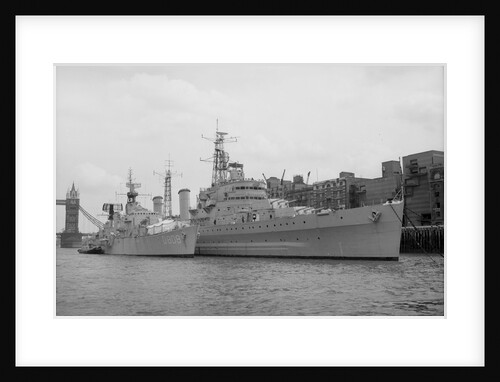 HMS 'Belfast' (1938) berthed at Symon's Wharf, Pool of London with the Dutch destroyer 'Holland' alongside by unknown