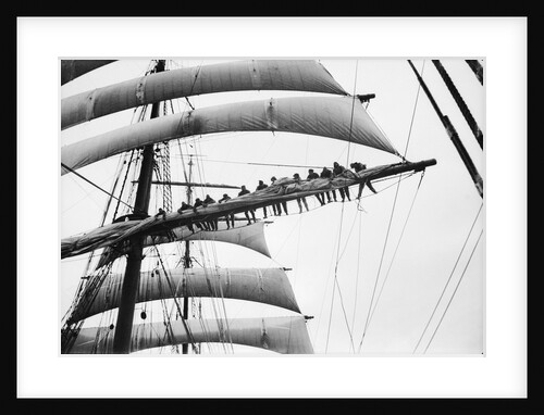 Out on the yard, furling the sail by Alan Villiers