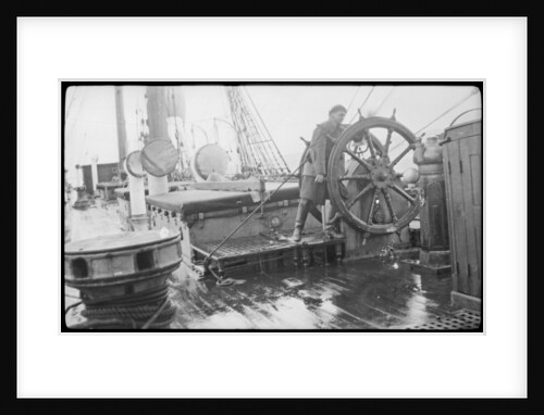 The 'Herzogin Cecile' (Fi, 1902) a seaman at the midships wheel in heavy weather. The helmsman is wearing a safety harness by unknown