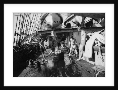 In the Doldrums after heavy rains, bathing on the well-deck by Alan Villiers