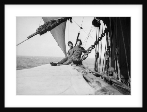 The girl stowaway seated on the main yard with the third mate by Alan Villiers