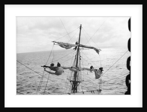 Aloft on the Mizzen furling the blown-out sails by Alan Villiers