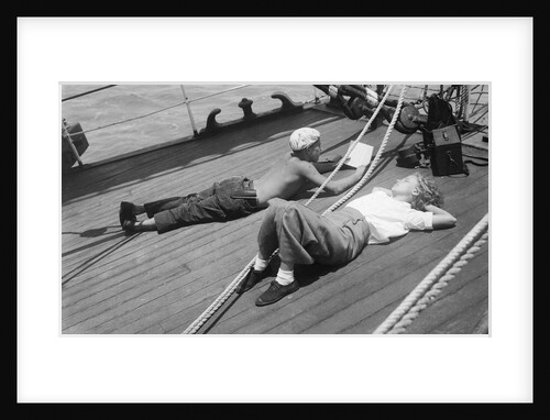 Elizabeth Jacobsen and Moses relaxing on the forecastle head by Alan Villiers