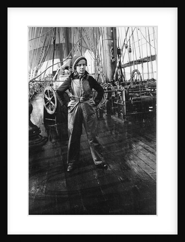 Elisabeth Jacobsen on deck, in oilskins, aboard 4 masted barque 'Parma' (Fi, 1902), ex 'Arrow' (Ruben de Cloux) by Alan Villiers
