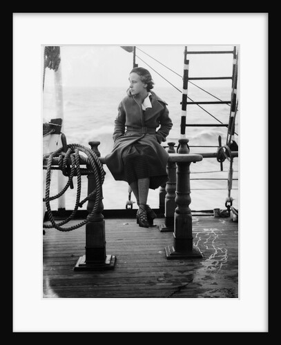 Elisabeth Jacobsenin shore clothes seated on the poop rail, aboard 4 masted barque 'Parma' (Fi, 1902), ex 'Arrow' (Ruben de Cloux) by Alan Villiers