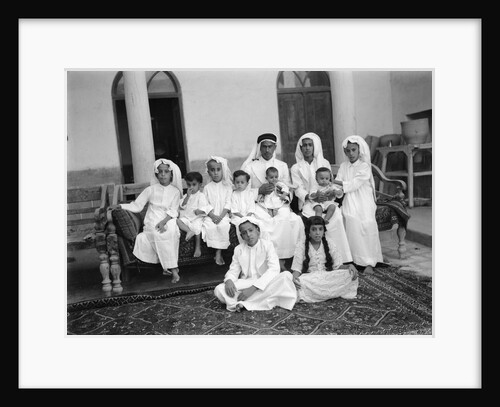 A Kuwaiti merchant at home with his family by Alan Villiers