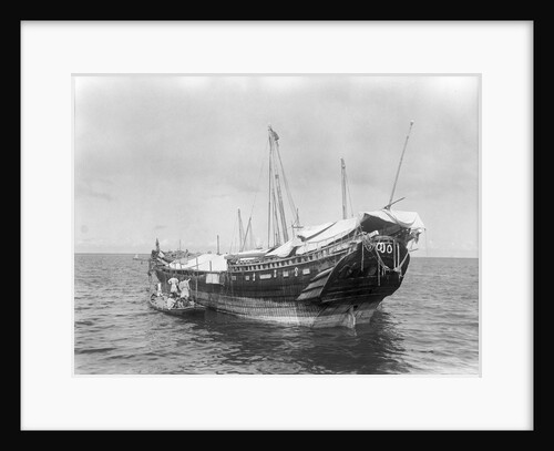 A baggala at anchor off Zanzibar discharging her cargo by Alan Villiers