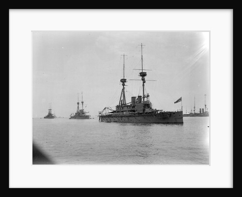 Battleship HMS 'Agamemnon' (1906) at anchor at Spithead, with awning rigged aft and 'Lord Nelson' astern of her by unknown