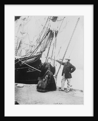 Photograph of John and Ann Gambles standing by the bow of the 'Ann Gambles' barque by unknown