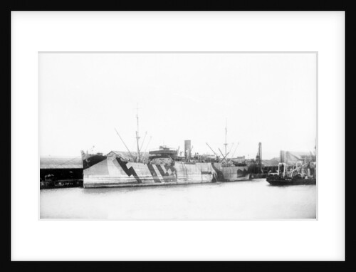 General cargo ship 'Vestalia' (Br, 1912) S. S. Co Ltd (Gow Harrison & Co), at quayside, camouflaged by unknown