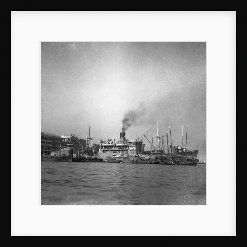 'Wing Sang' (Br, 1938), at anchor, surrounded by small craft by unknown