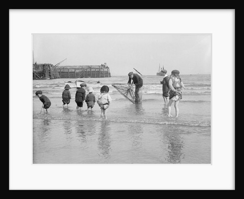 Boys and girls watch intently as a local fisherman wields his net in Scarborough, Yorkshire by Samuel Coupe Fox