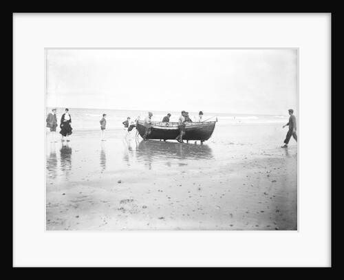 Five fishermen carrying a Sheringham crab boat up the beach, assisted by three boys, at Lowestoft by Smiths Suitall Ltd.