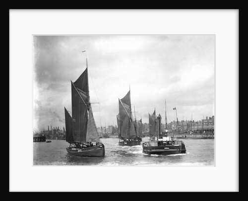 The trawler 'LT372' under sail with 'LT205' in tow of the paddle tug 'Imperial' (1879) leaving the harbour at Lowestoft, Suffolk by Smiths Suitall Ltd.