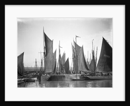 A view across Lowestoft harbour to the entrance of the trawl basin in the morning by Smiths Suitall Ltd.