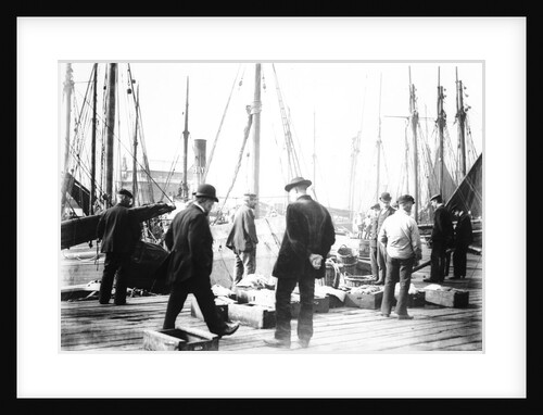 Unloading the catch in Lowestoft Harbour, with the South Pier Pavilion in the background by Smiths Suitall Ltd.