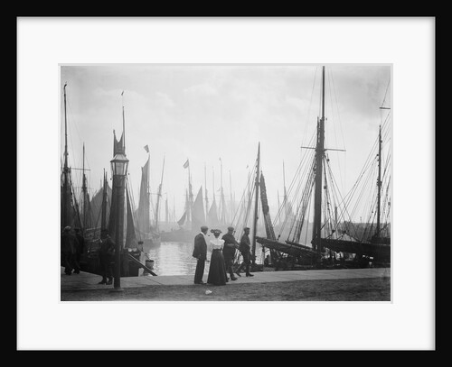 Trawlers berthed in the outer harbour with the morning mist rising at Lowestoft, Suffolk by Smiths Suitall Ltd.