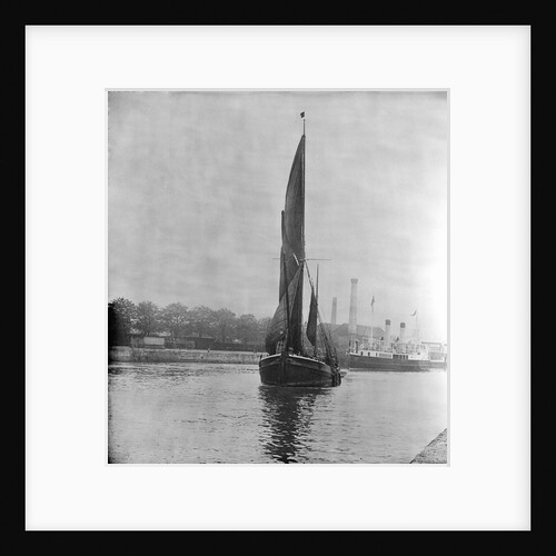 A view across the New Cut at Ipswich with an unidentified spritsail barge under sail leaving by Smiths Suitall Ltd.