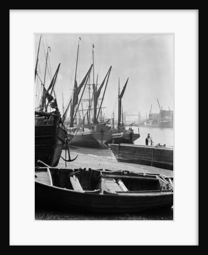The Thames at low water with various crafts beached on the Southbank and Tower Bridge in the background. by Eagar