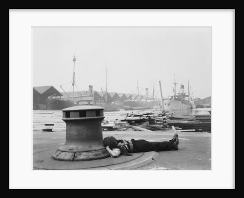 Man resting at Surrey Commercial Docks by unknown