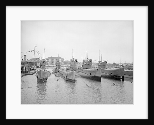 HMS Submarine 'L71' (1919), berthed at HMS 'Dolphin', Haslar Creek, with 'L56' (1919) and 'L53' (1919) inboard and 'L69' (1918) and 'L21' (1919) outboard by Unknown