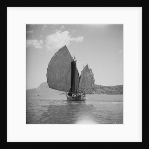 A starboard bow view of a fishing junk drifting in Tolo Harbour, Hong Kong by David Watkin Waters