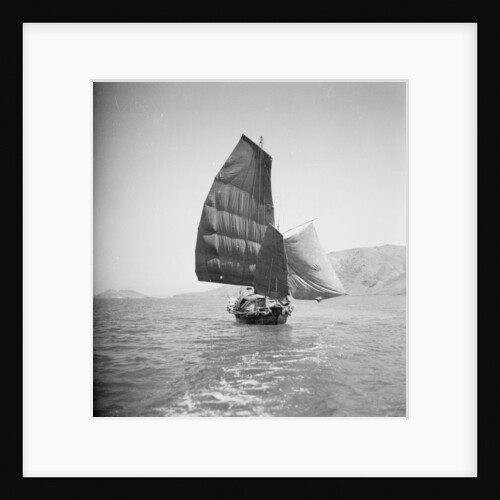 A bow view of a cargo sampan under sail in Tolo Harbour, Hong Kong by David Watkin Waters